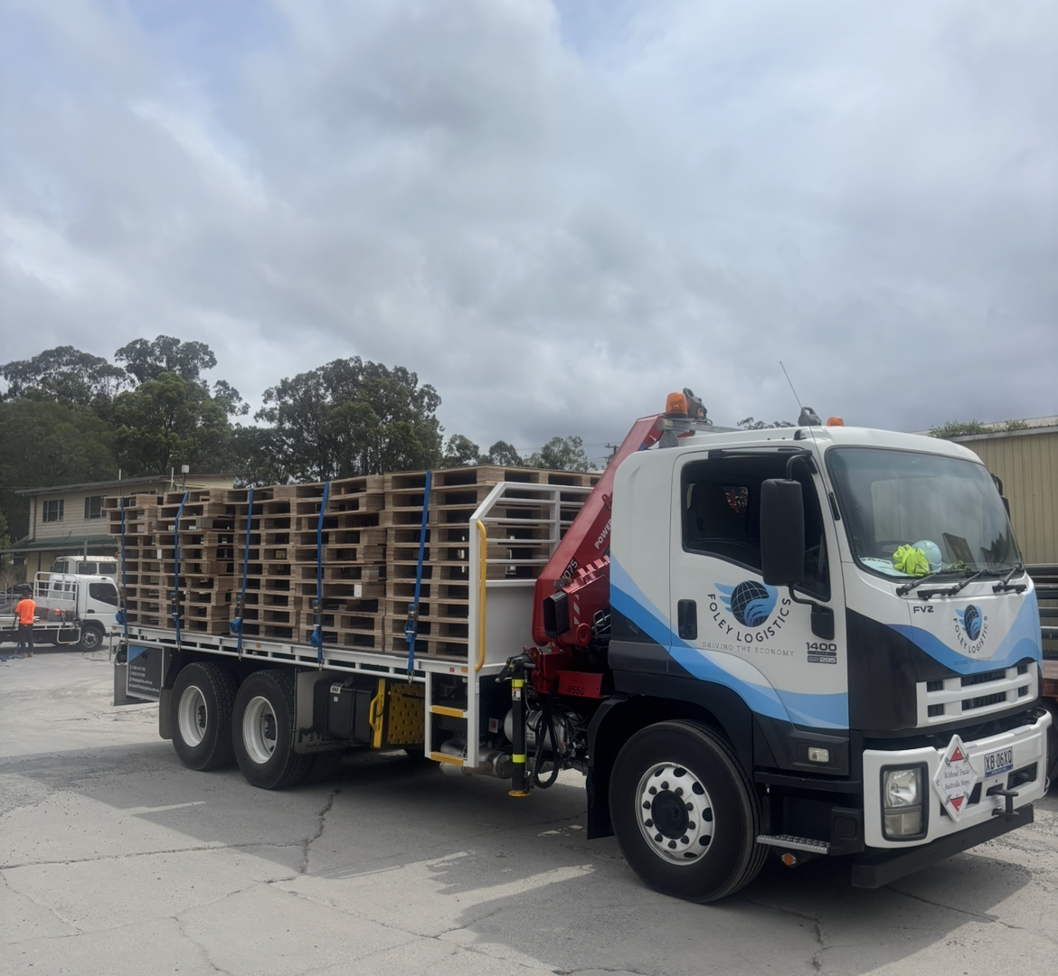 Foley Logistics truck loaded with pallets for Chevron One Residences
