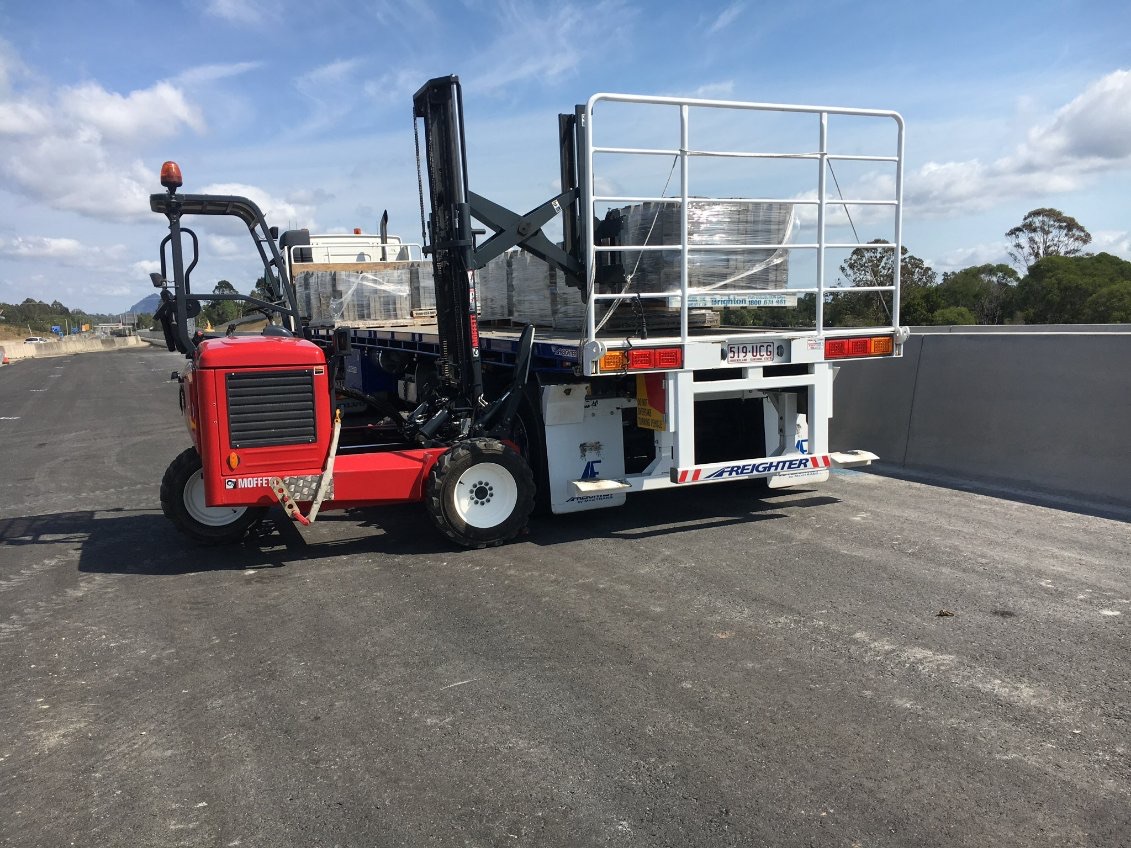 Foley Logistics truck-mounted Moffett forklift and flatbed combination
